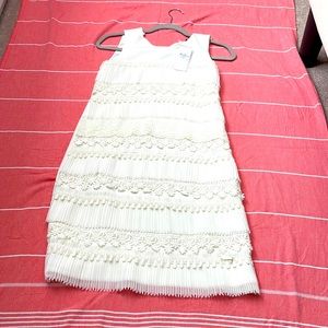 Beautiful guess white floral dress with trimming never been worn new with tags